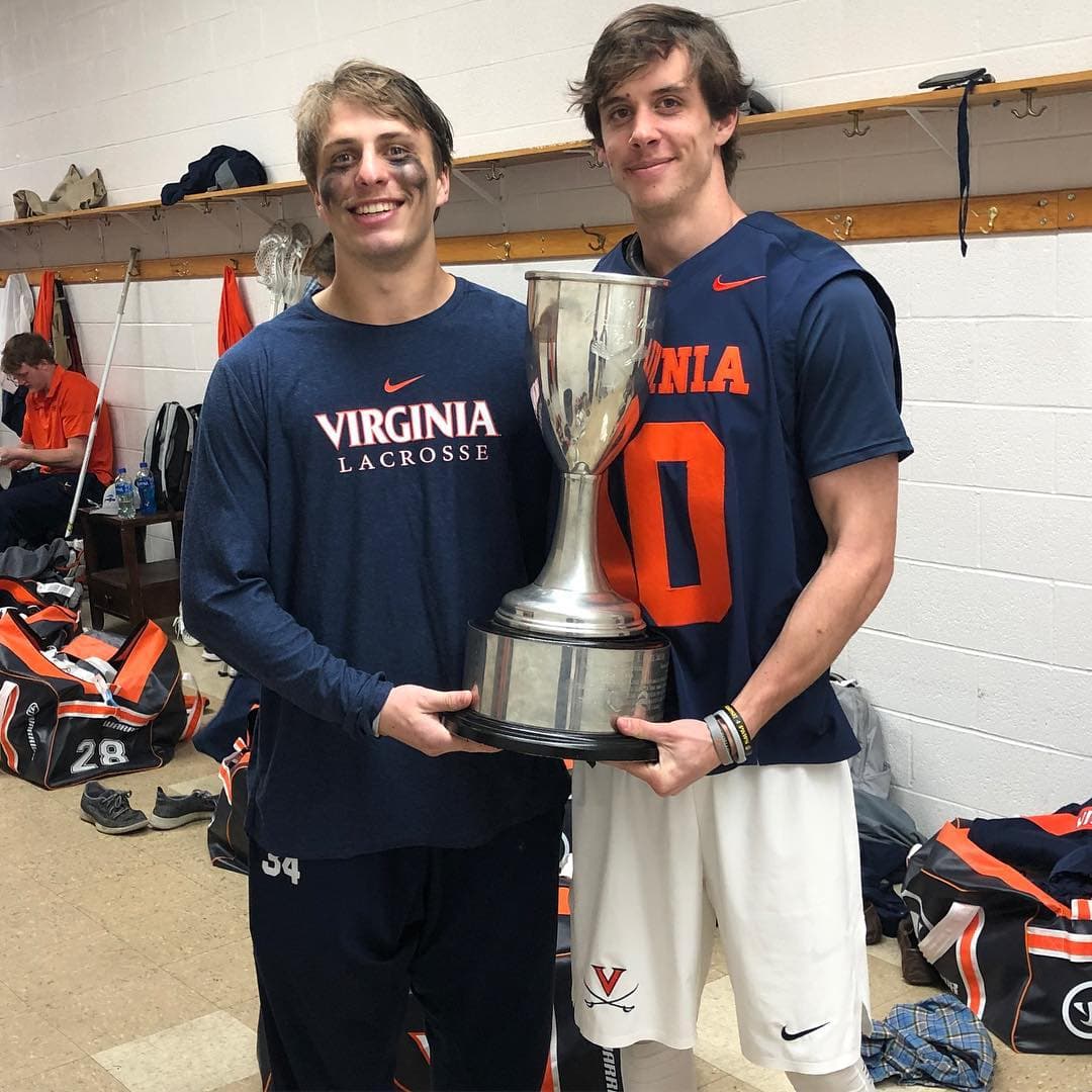 Xander Dickson with teammates and championship trophy