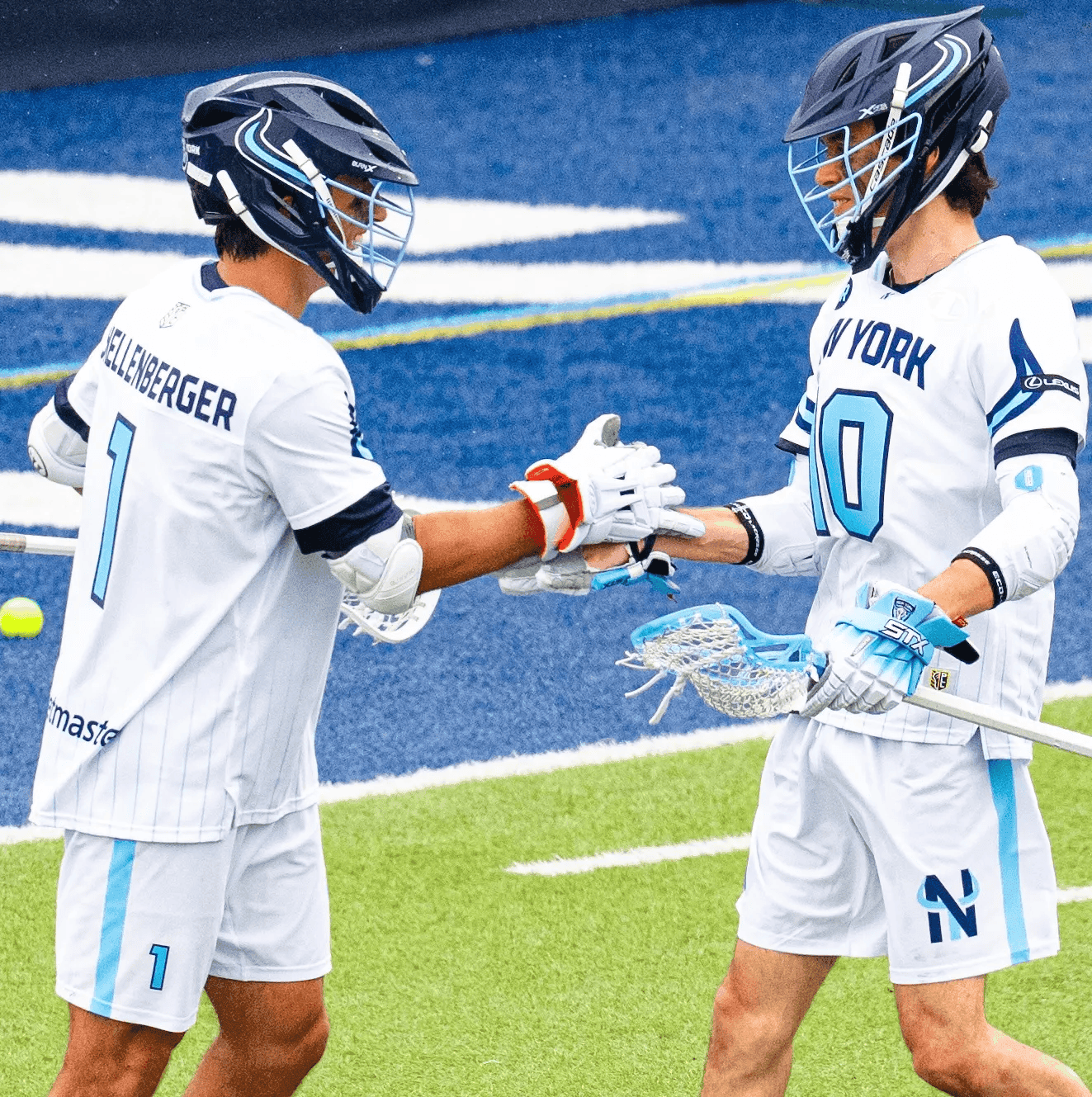 Lacrosse players shaking hands on the field